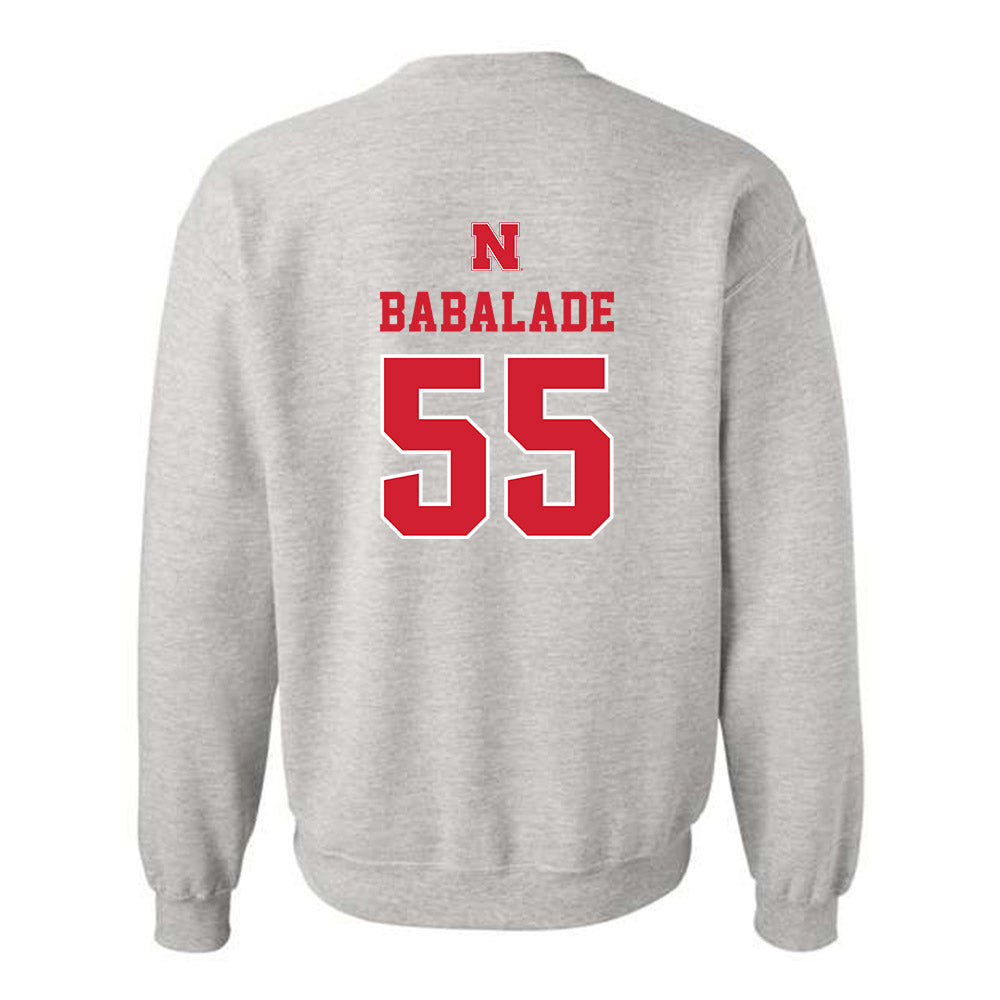 Nebraska - NCAA Football : Tree Babalade - Classic Shersey Crewneck Sweatshirt-1