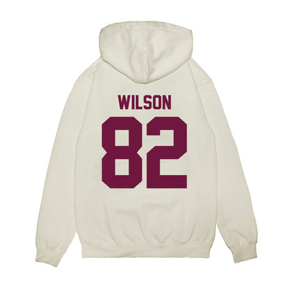 Texas A&M - NCAA Football : Jonah Wilson - Vintage Helmet Premium Hooded Sweatshirt-1