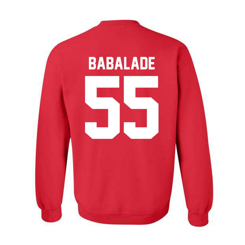 Nebraska - NCAA Football : Tree Babalade - Classic Shersey Crewneck Sweatshirt-1
